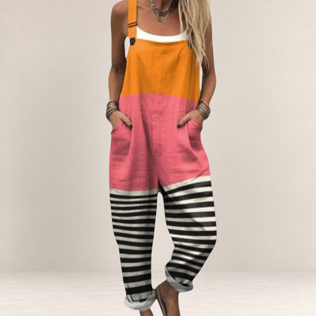 Valvet Oak House Antigoni color-blocked jumpsuit with orange, pink, and black-and-white striped wide-leg trousers.