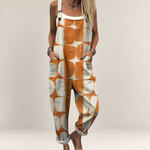 Valvet Oak House loose-fit jumpsuit in orange and white geometric print with adjustable straps and side pockets