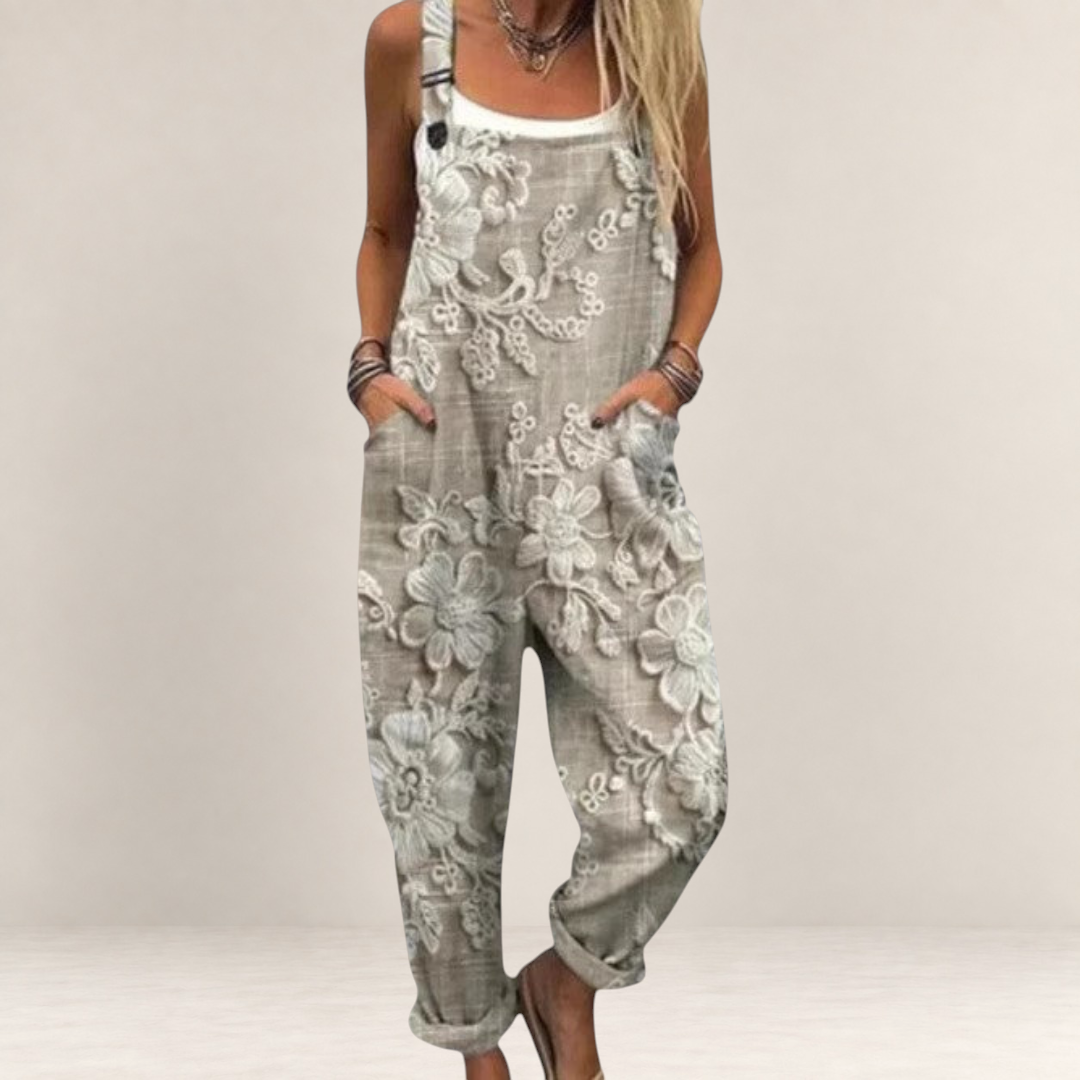 Valvet Oak House beige floral print loose-fit jumpsuit with adjustable straps and wide legs for comfortable style.