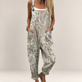 Valvet Oak House beige floral print loose-fit jumpsuit with adjustable straps and wide legs for comfortable style.