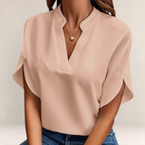 Valvet Oak House Agatha elegant beige blouse with a structured collar and short flowy sleeves worn with blue jeans