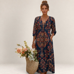 Valvet Oak House Leda long bohemian dress with ethnic floral patterns, V-neck, and pockets, worn by a woman.
