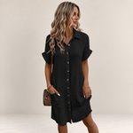 Valvet Oak House black button-down shirt dress with short sleeves and pockets, worn by a woman on a cobblestone street