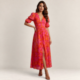 Valvet Oak House Elena maxi dress in pink and orange floral print with deep V-neck, puff sleeves, and front slit