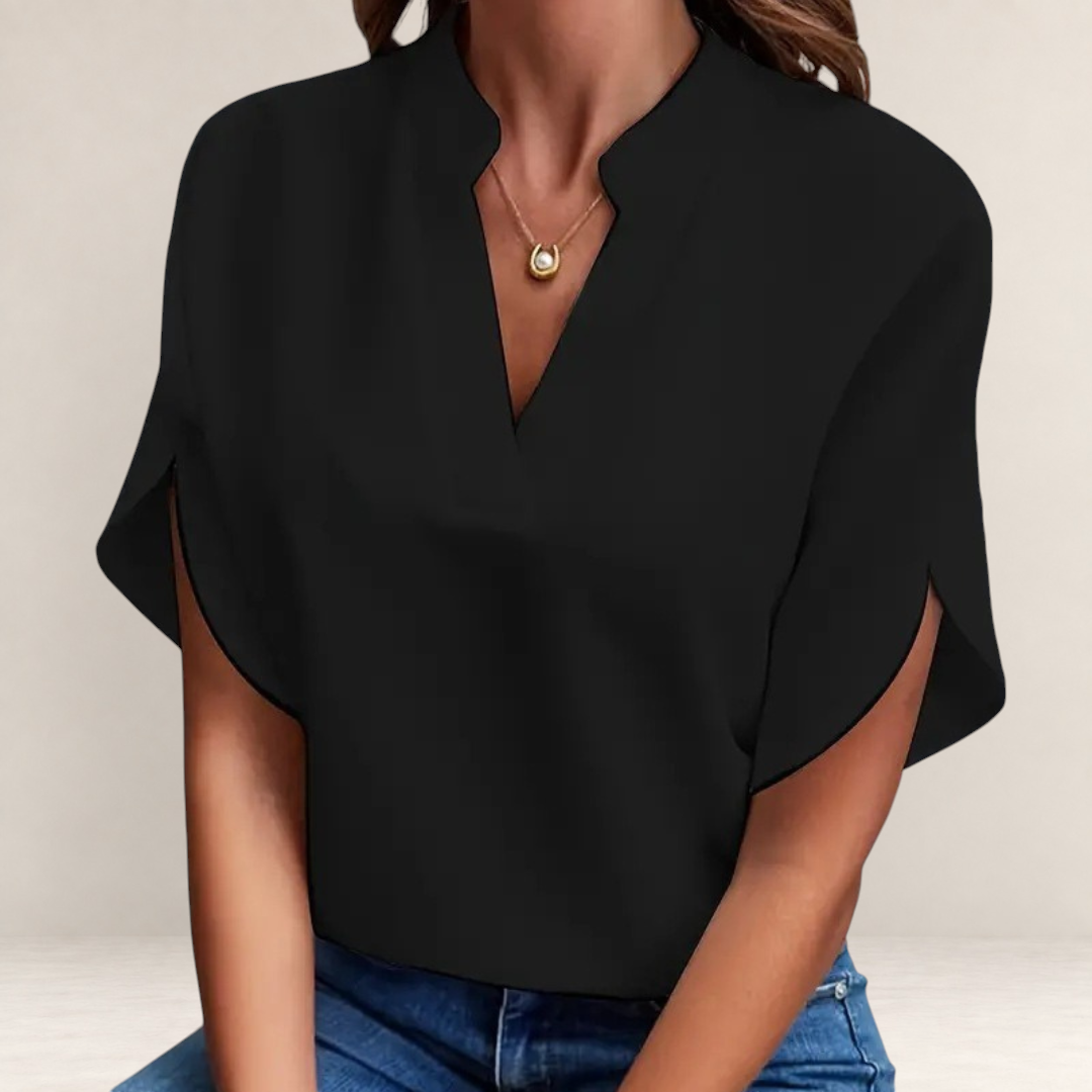 Valvet Oak House Agatha black blouse with a structured collar and short sleeves worn with blue jeans