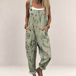 Valvet Oak House sage green floral print jumpsuit with wide legs, adjustable straps, and side pockets on a model