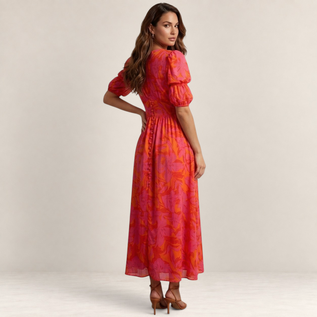 Valvet Oak House Elena pink and orange floral maxi dress with puff sleeves and button detail on a model