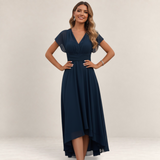 Valvet Oak House navy blue chiffon A-line dress with a V-neckline and high-low hem worn by a smiling model