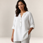 Valvet Oak House white linen-blend blouse with a V-neck and button placket worn by a woman with dark wavy hair.
