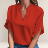 Valvet Oak House Agatha red blouse with a structured collar and short sleeves worn with blue jeans