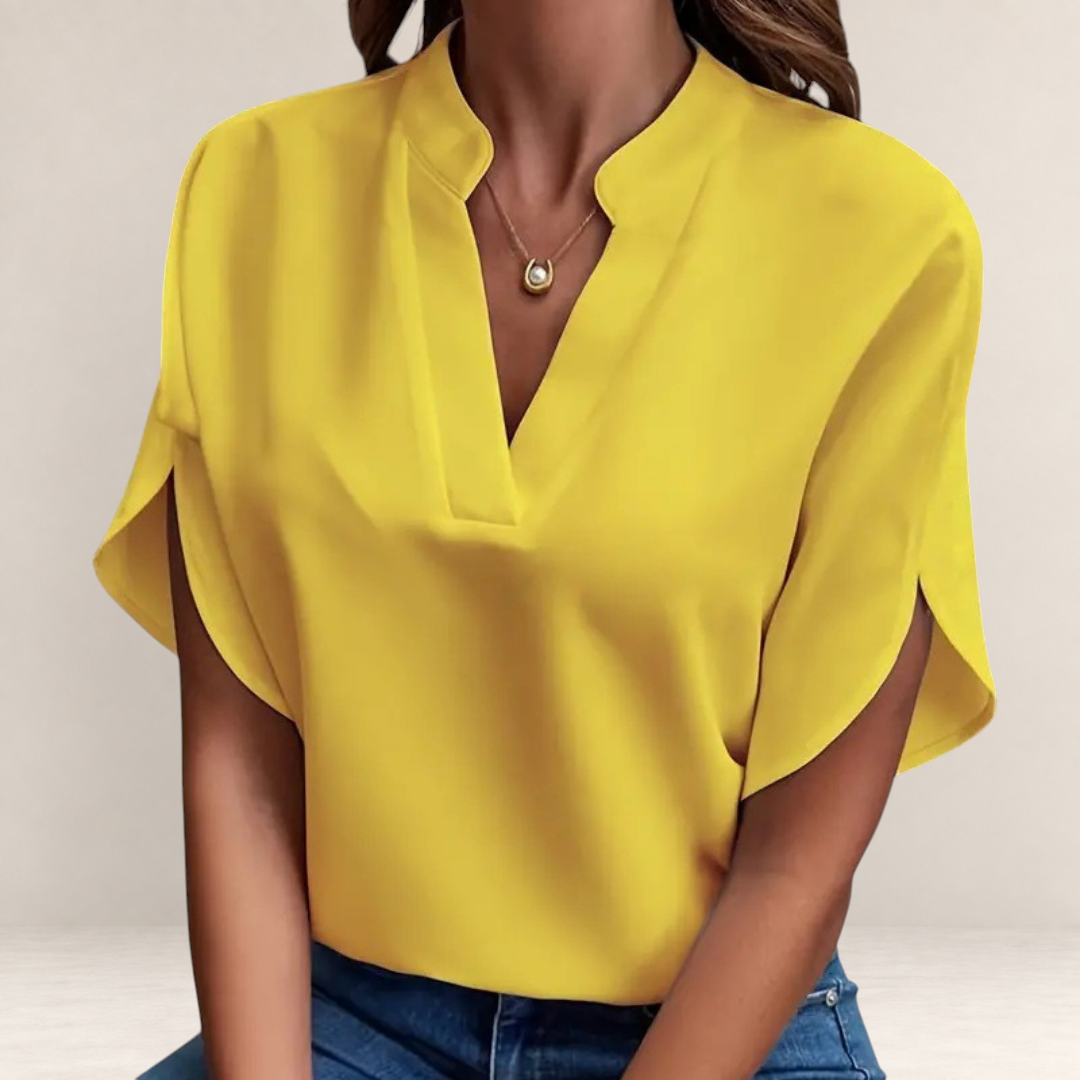 Valvet Oak House Agatha yellow blouse with a structured collar and short sleeves worn with blue jeans