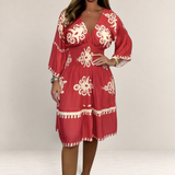 Valvet Oak House Hestia red boho summer dress with cream floral patterns, V-neckline, and three-quarter sleeves.