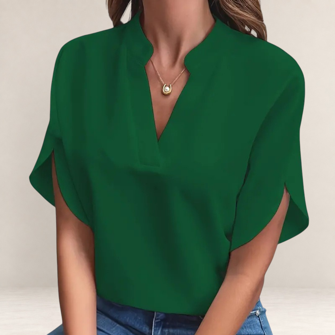 Valvet Oak House Agatha elegant emerald green blouse with a structured collar and short split sleeves