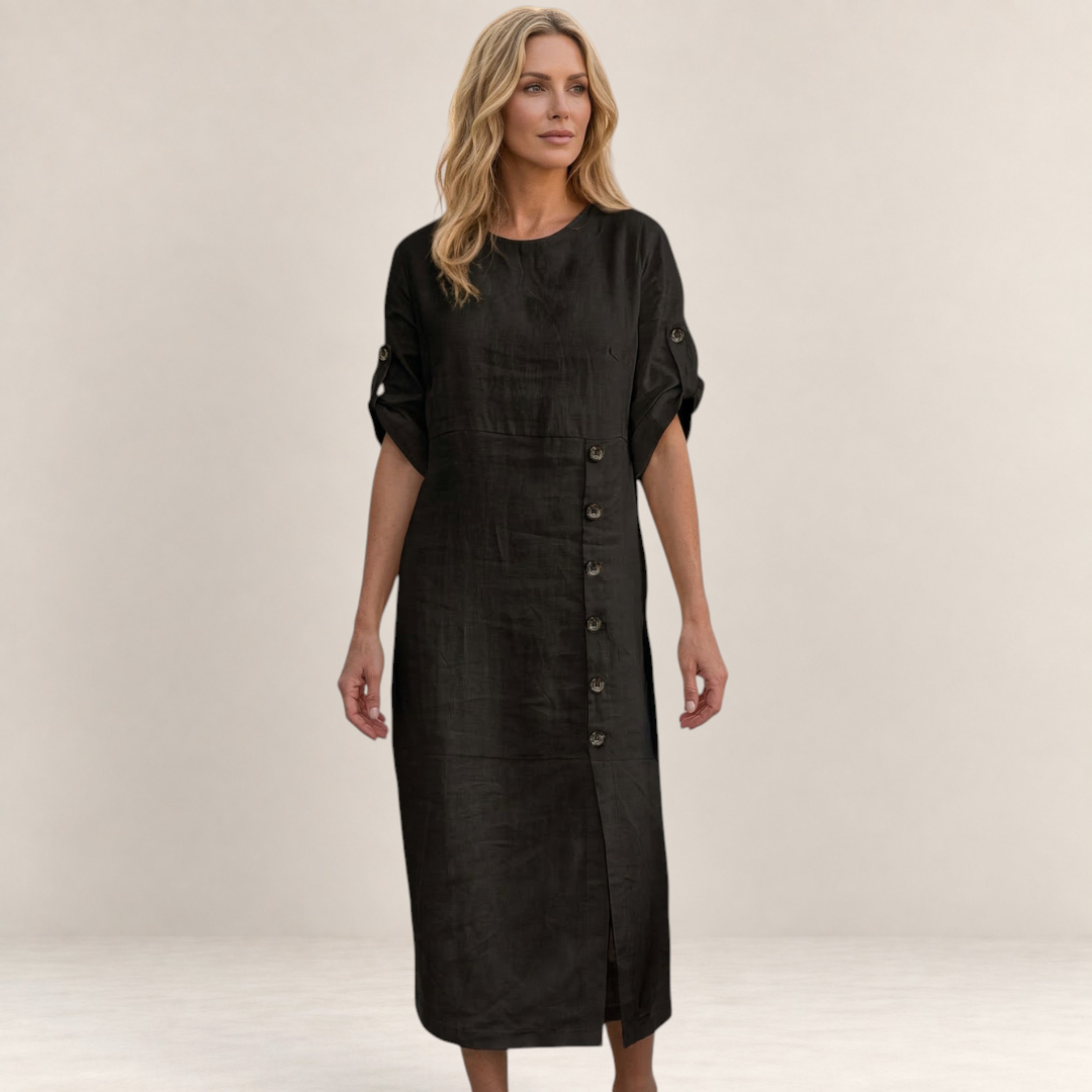 Valvet Oak House Helena black midi dress with button details and short sleeves worn by a blonde model