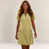 Valvet Oak House light yellow cotton-linen A-line dress with front zip and pockets worn by a woman in Greece