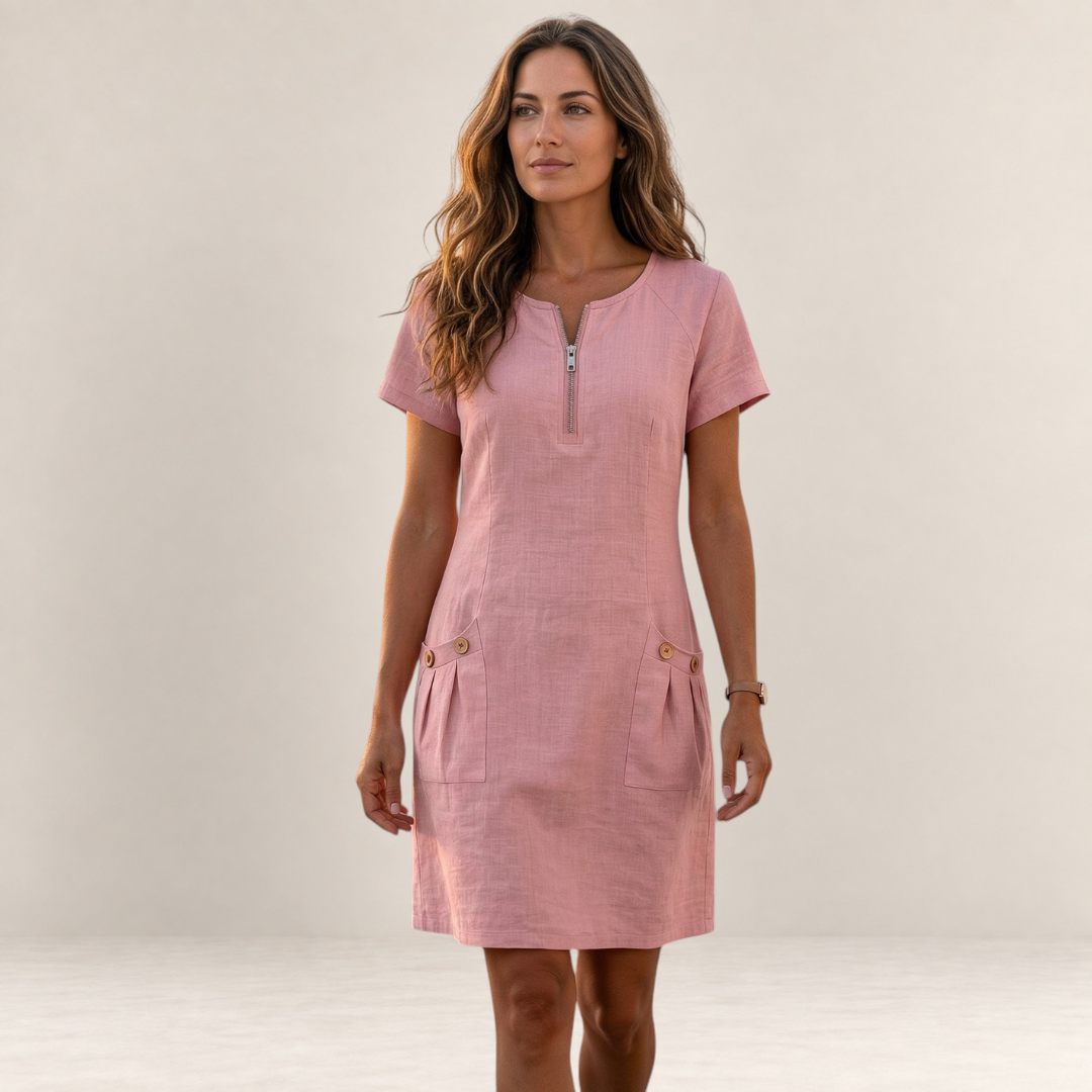 Valvet Oak House pink cotton and linen A-line short dress with a front zipper and pockets worn by a woman outdoors