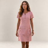 Valvet Oak House pink cotton and linen A-line short dress with a front zipper and pockets worn by a woman outdoors