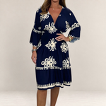 Valvet Oak House Hestia navy blue boho midi dress with white floral embroidery and bell sleeves on a model