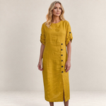 Valvet Oak House Helena mustard yellow midi dress with button details and rolled sleeves on a blonde model