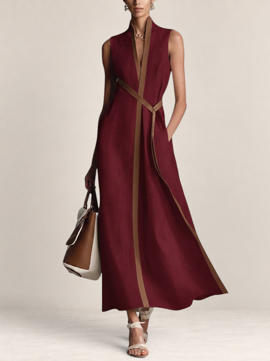 Valvet Oak House sleeveless burgundy linen-blend maxi dress with a stand collar and brown trim, worn by a model.