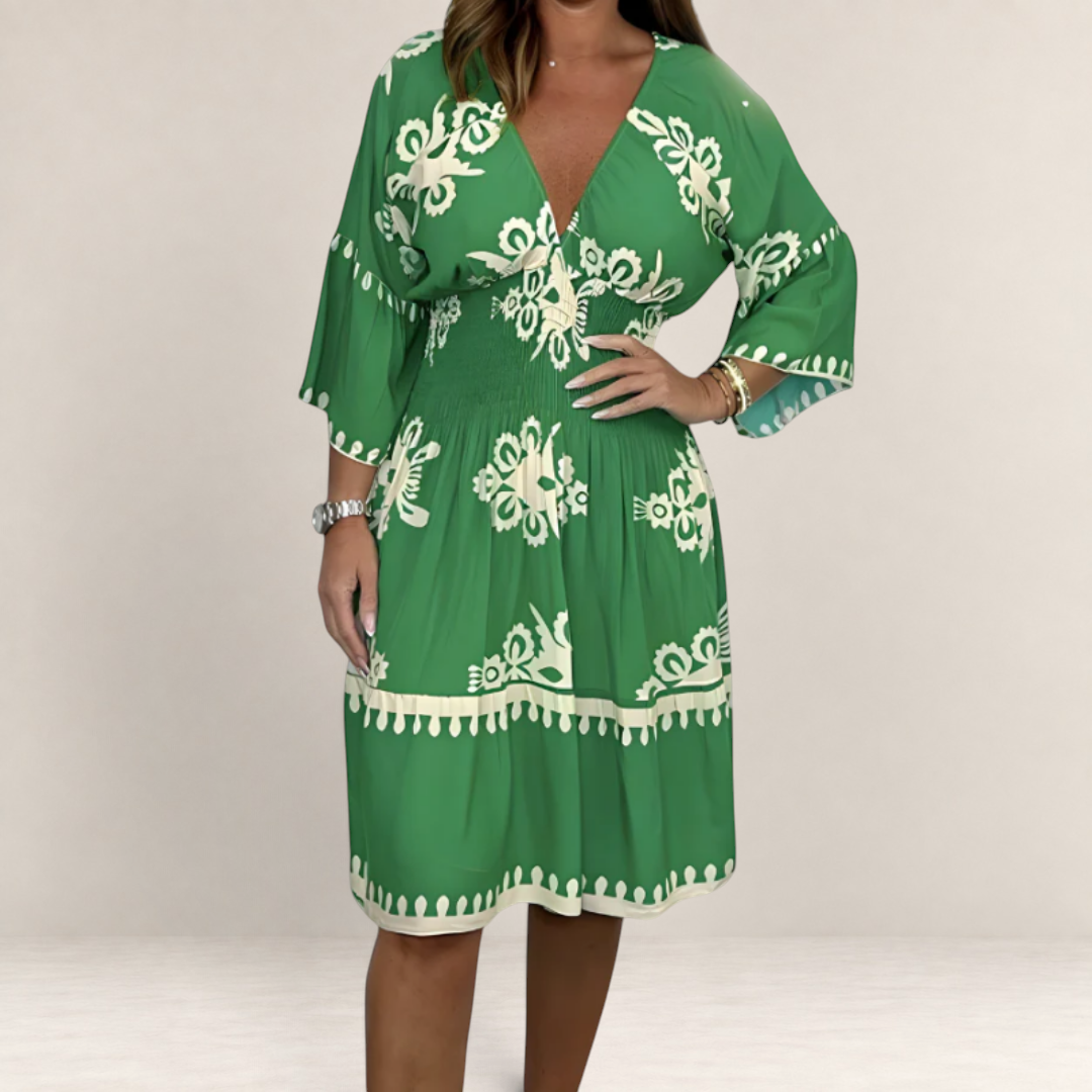 Valvet Oak House Hestia green boho dress with white floral print, V-neckline, and smocked waist on a model