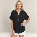 Valvet Oak House black lightweight V-neck top with short sleeves worn by a smiling woman with blonde hair