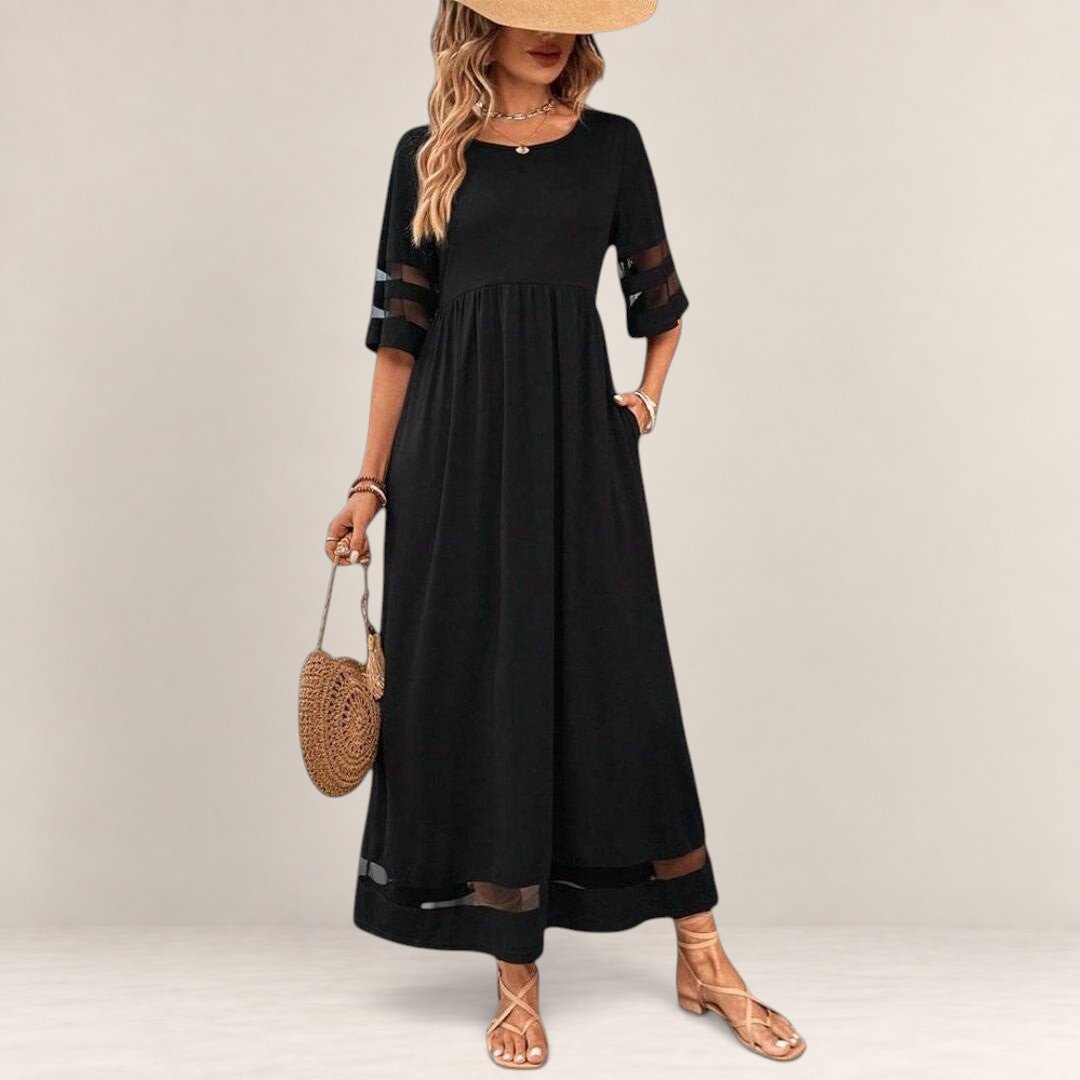 Valvet Oak House black midi dress with empire waist, sheer mesh sleeve details, and a flowy, comfortable fit.