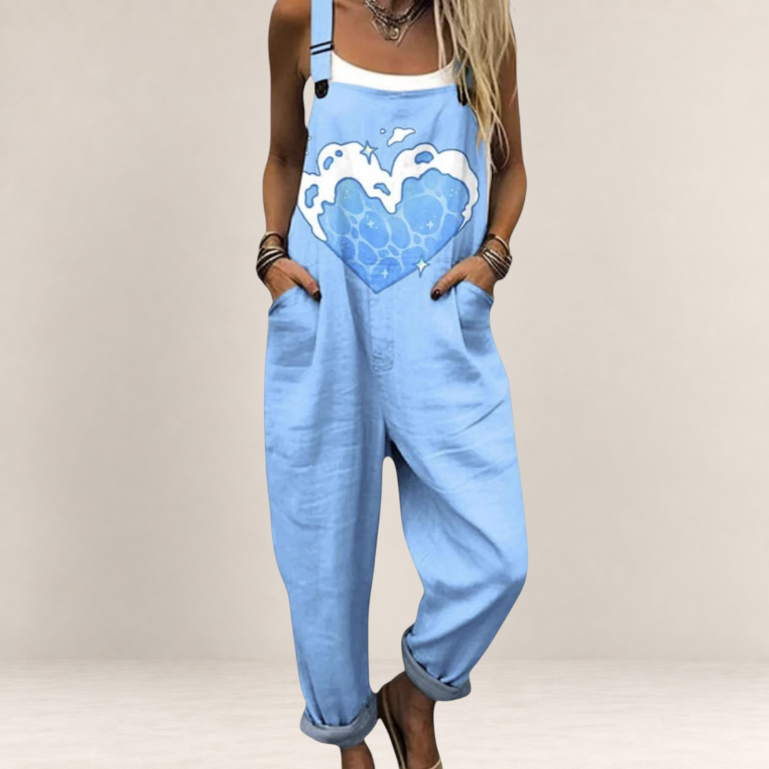 Valvet Oak House light blue loose-fit dungaree jumpsuit with a heart-shaped wave print and adjustable straps