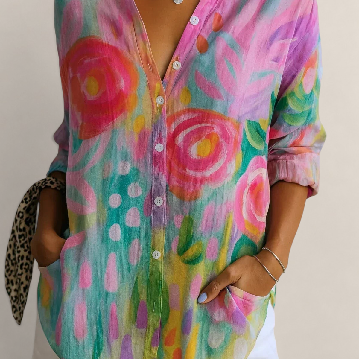 Valvet Oak House Pietra button-down shirt with vibrant pink, yellow, and teal floral abstract print and pockets.
