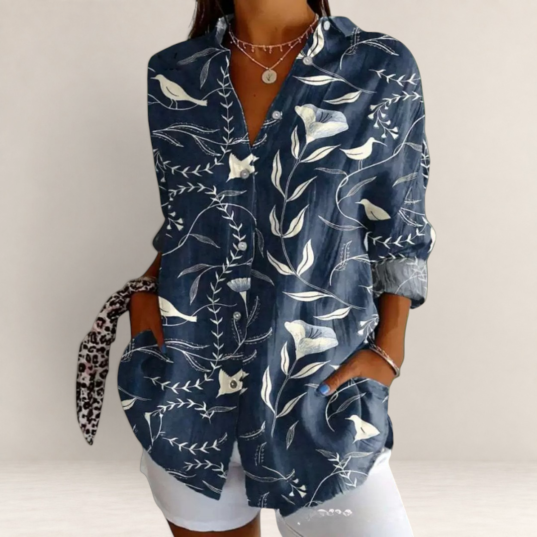Valvet Oak House navy blue long-sleeve blouse with white floral and bird print, featuring a classic collar and pockets