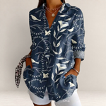Valvet Oak House navy blue long-sleeve blouse with white floral and bird print, featuring a classic collar and pockets