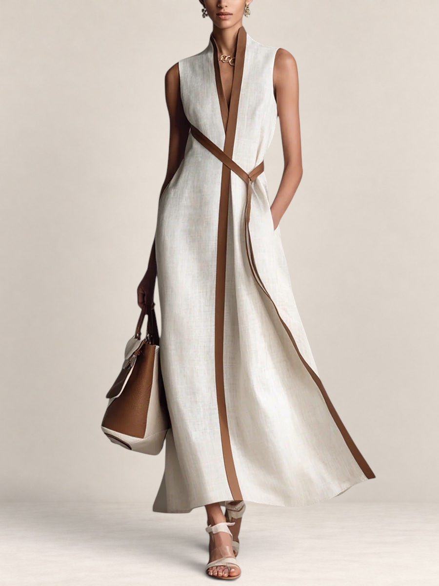Valvet Oak House sleeveless cream linen maxi dress with brown leather trim and a matching waist tie on a model.