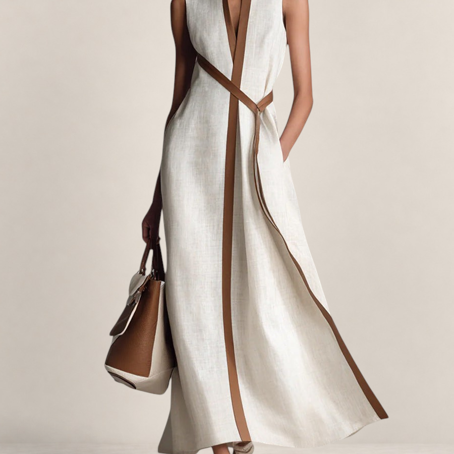 Valvet Oak House sleeveless cream linen maxi dress with brown leather trim and a matching waist tie on a model.