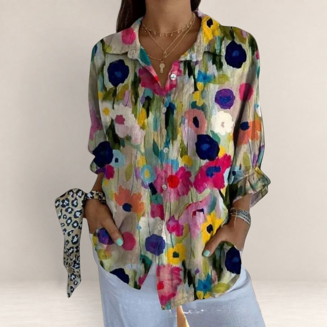 Valvet Oak House long-sleeve button-down shirt with vibrant red, pink, and yellow floral print on a neutral base