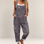 Valvet Oak House grey floral print loose-fit jumpsuit with wide legs and adjustable straps on a woman