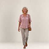 Valvet Oak House light pink cotton blouse with ruffled collar worn by a smiling woman with trousers and sandals
