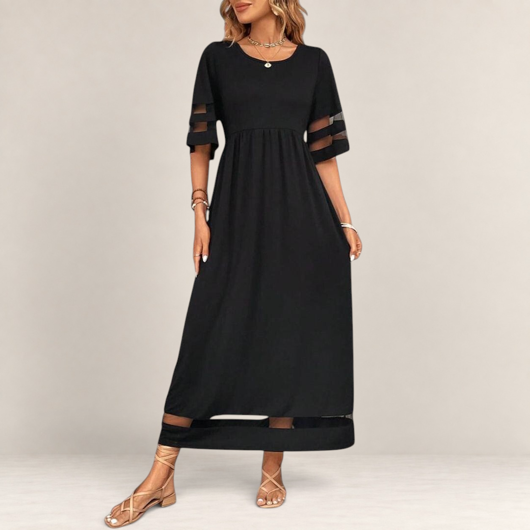 Valvet Oak House black midi dress with empire waist, sheer mesh sleeve details, and a flowing, breathable silhouette.