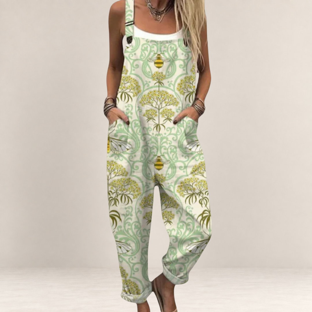 Valvet Oak House Dimitra printed jumpsuit with bee pattern, wide legs, and adjustable straps in light green and yellow