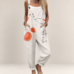 Valvet Oak House loose-fit linen jumpsuit in beige with orange botanical print and adjustable straps