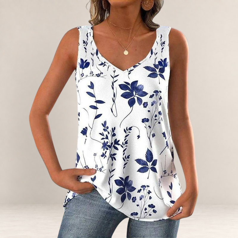 Valvet Oak House white sleeveless tank top with blue floral pattern and V-neckline worn by a woman
