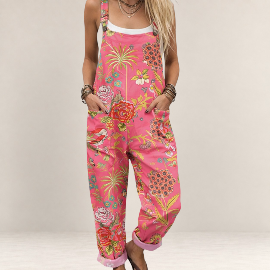 Valvet Oak House pink floral printed jumpsuit with wide legs, adjustable straps, and side pockets on a model
