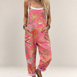 Valvet Oak House pink floral printed jumpsuit with wide legs, adjustable straps, and side pockets on a model