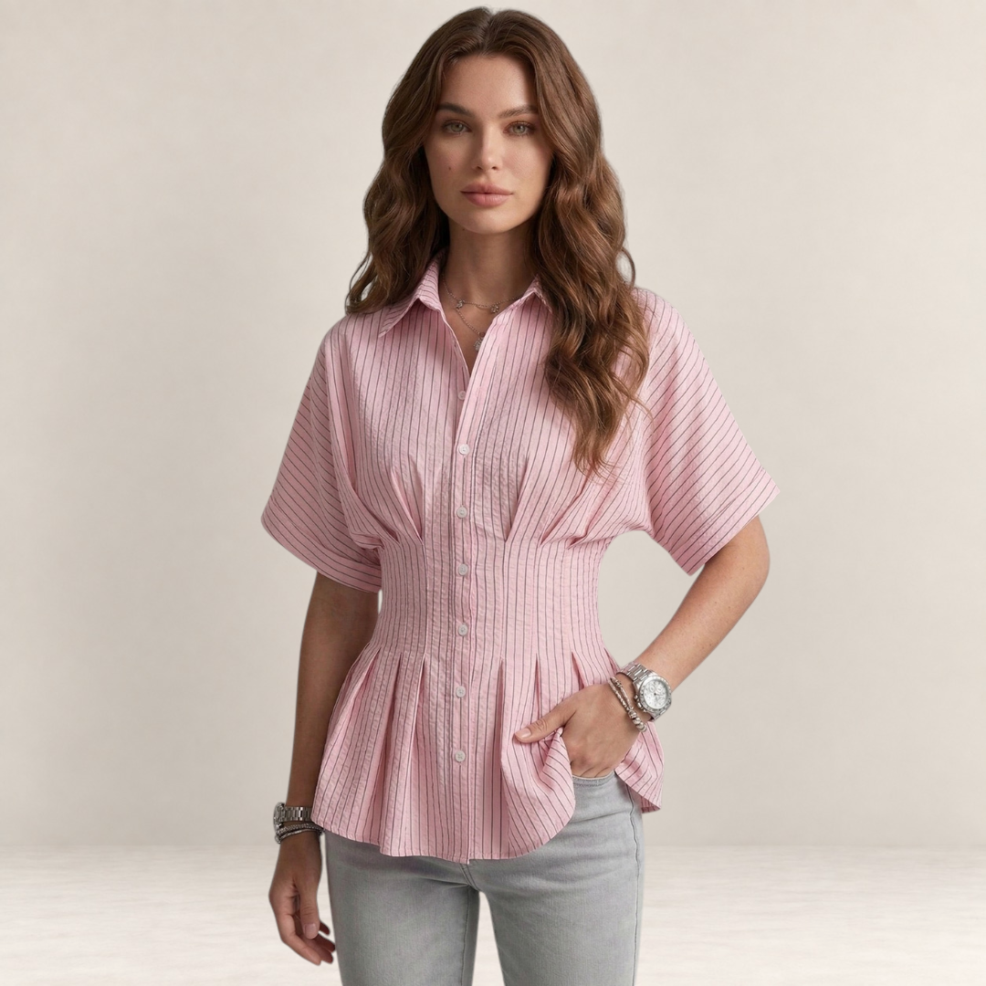 Valvet Oak House Pietra pink striped button-down blouse with short sleeves and a cinched waist on a model.