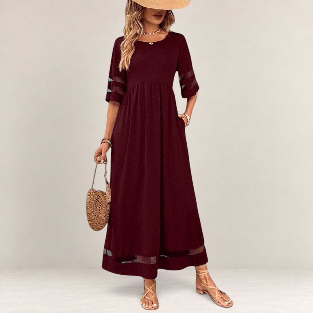 Valvet Oak House burgundy midi dress with empire waist, sheer sleeve panels, and pockets, styled with a straw hat.