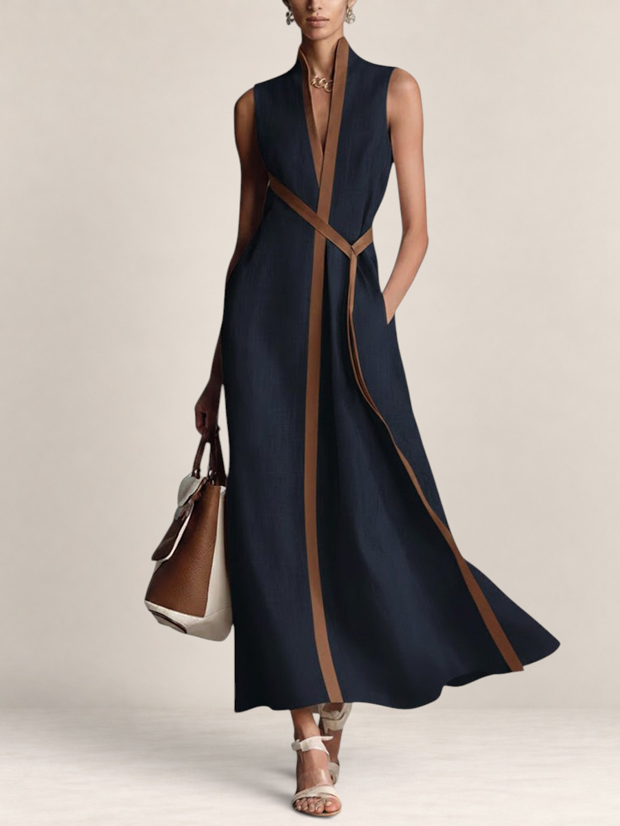 Valvet Oak House navy blue linen blend sleeveless maxi dress with brown trim and stand-up collar on a model