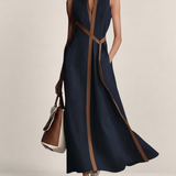 Valvet Oak House navy blue linen blend sleeveless maxi dress with brown trim and stand-up collar on a model
