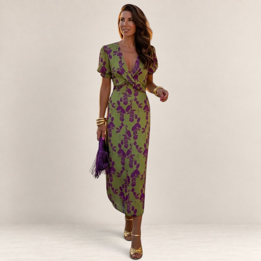 Valvet Oak House Lara midi dress in green with purple floral print, featuring a V-neck and puff sleeves on a model.