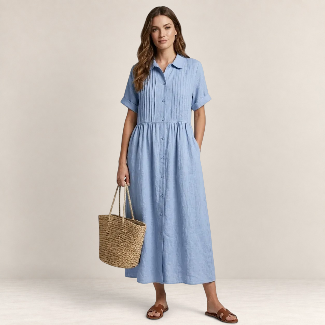 Valvet Oak House light blue cotton shirt dress with pleated bodice, short sleeves, and button-down front on a model.