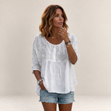 Valvet Oak House white blouse with floral embroidery and patchwork detail worn by a woman with denim shorts
