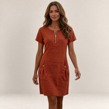 Valvet Oak House rust-colored A-line cotton-linen dress with a front zipper and pockets worn by a woman outdoors